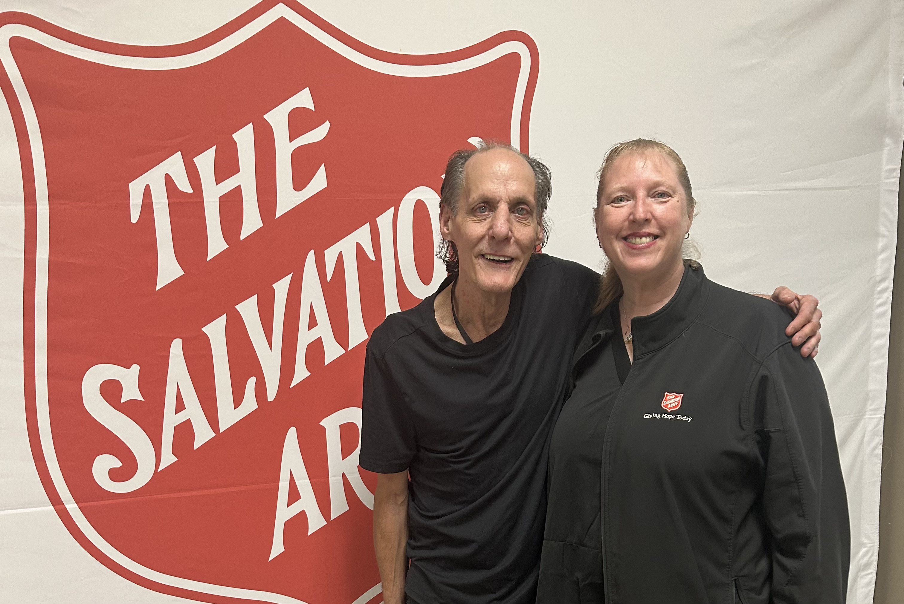 Murray stands with Salvation Army worker