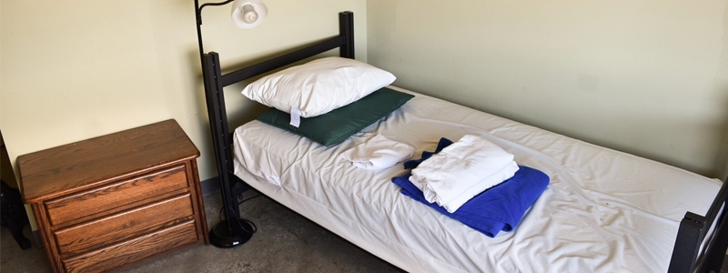Program housing studio apartment sleeping area 800x300